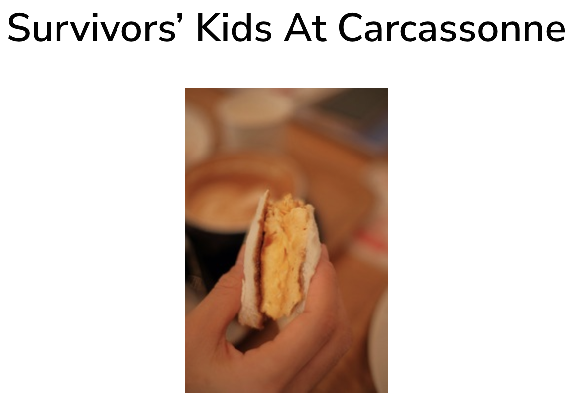 Photo of a hand holding a cheese and bread sandwich